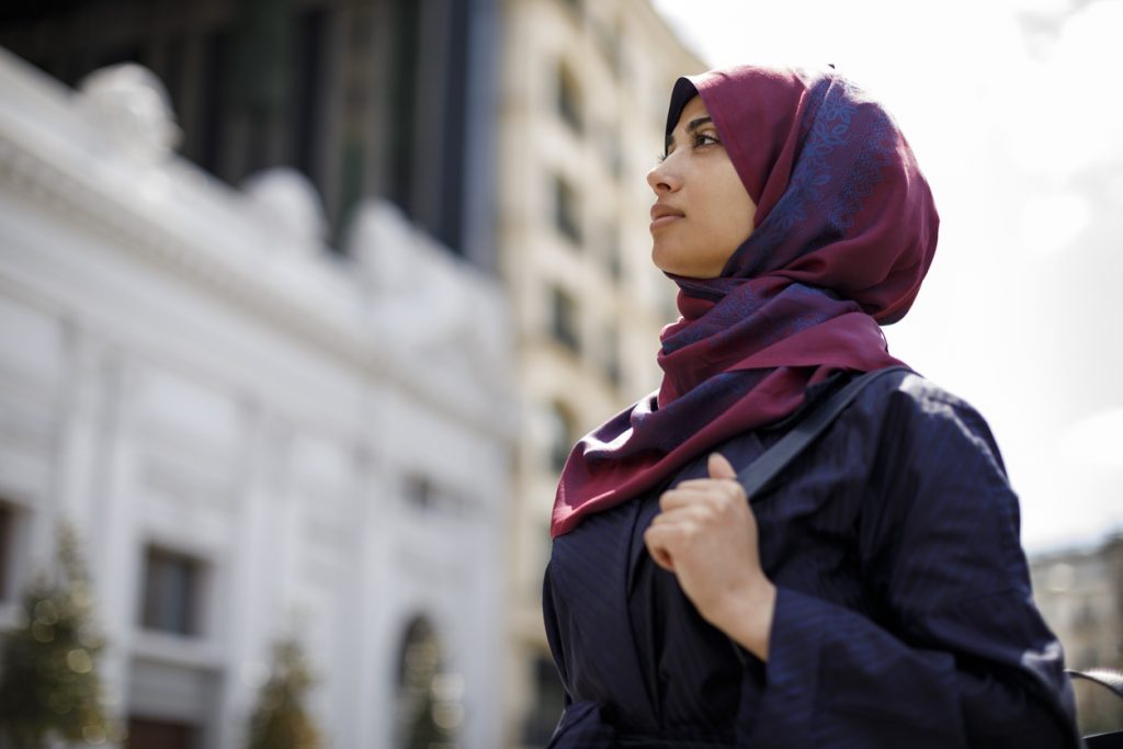 Young muslim woman traveling